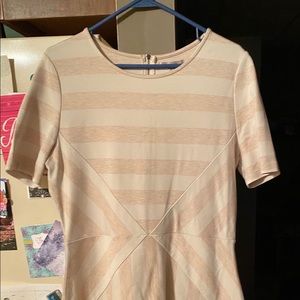 Knee length dress with stripes.